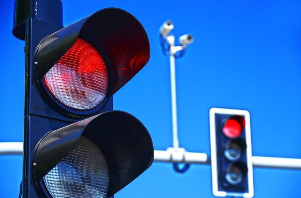 red light camera and blue sky